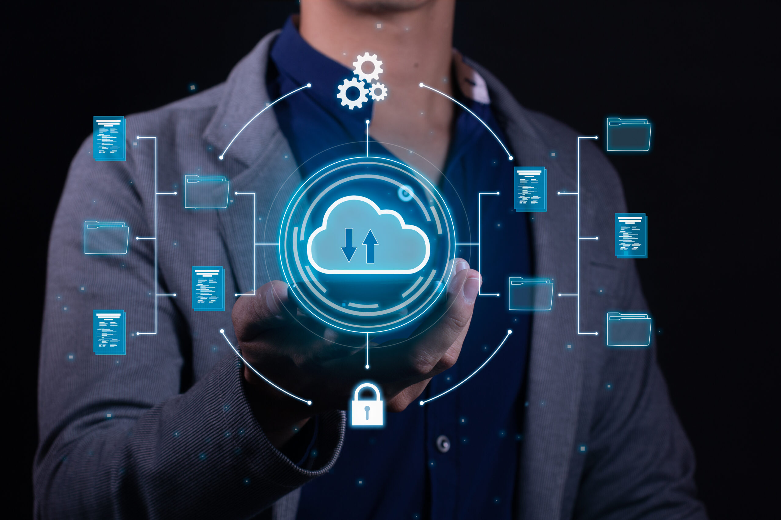 A man employs cloud-based computing on his smartphone to facilitate data transmission, storage, backup, and access Cloud